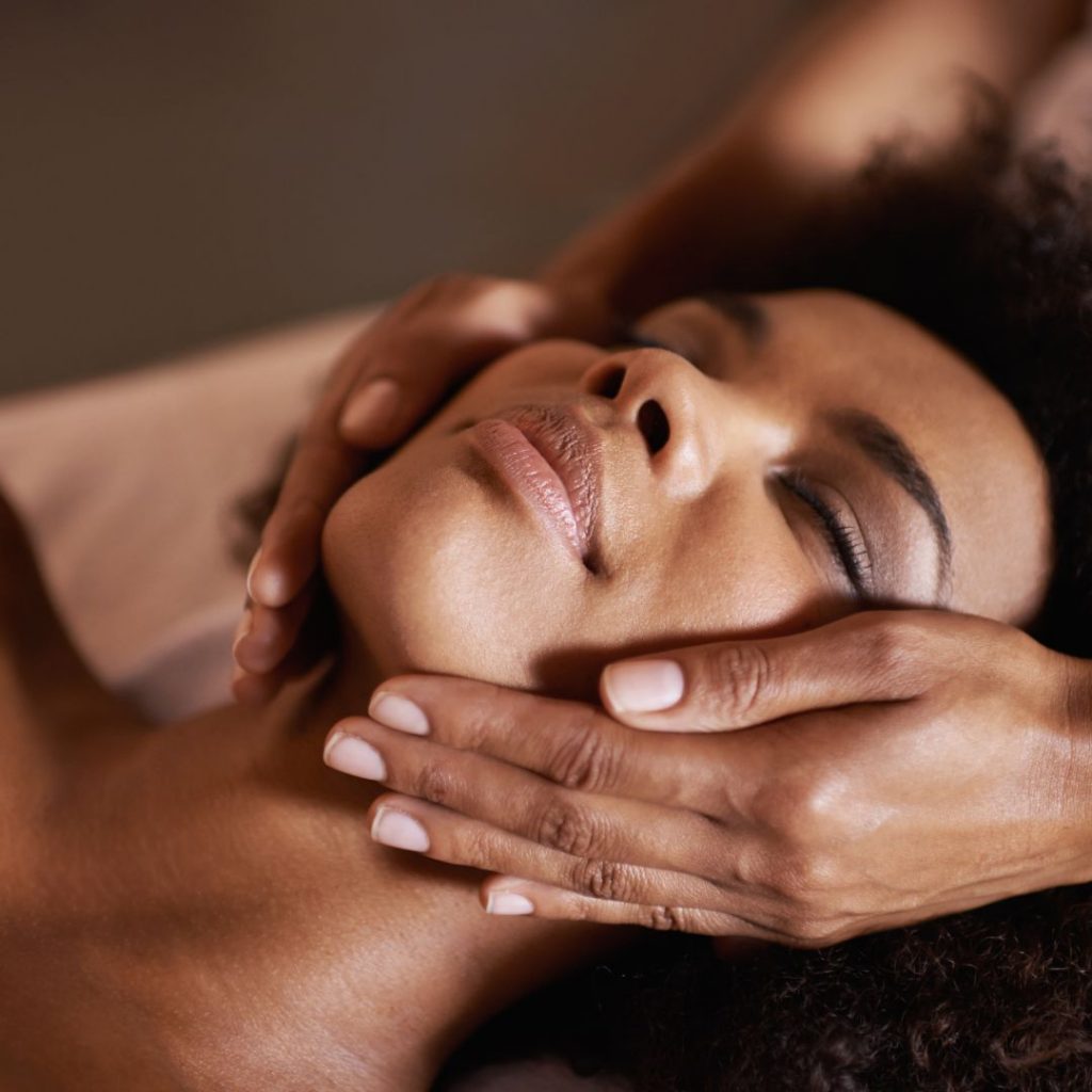 Relaxing facial massage therapy session