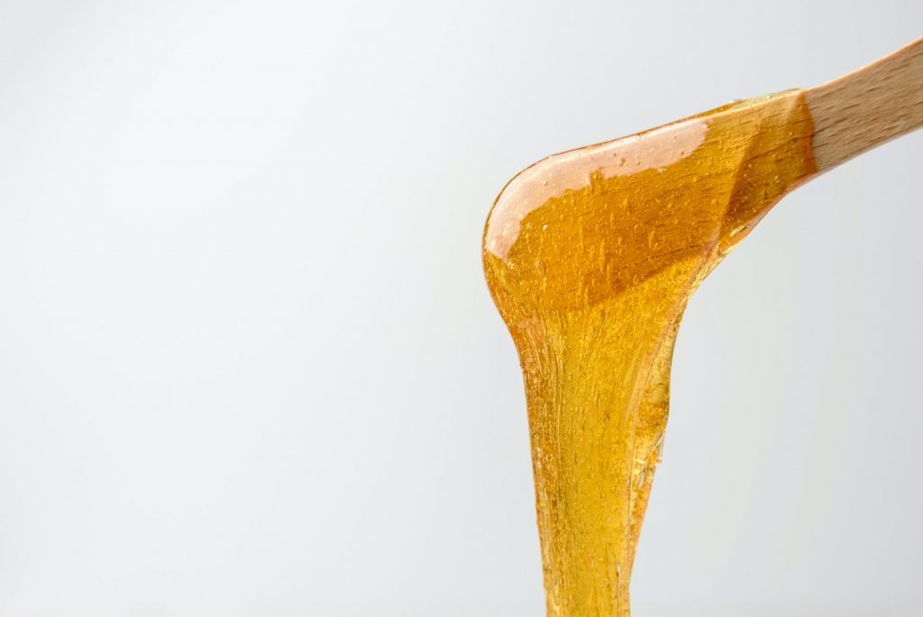 Liquid sugar wax on spatula
