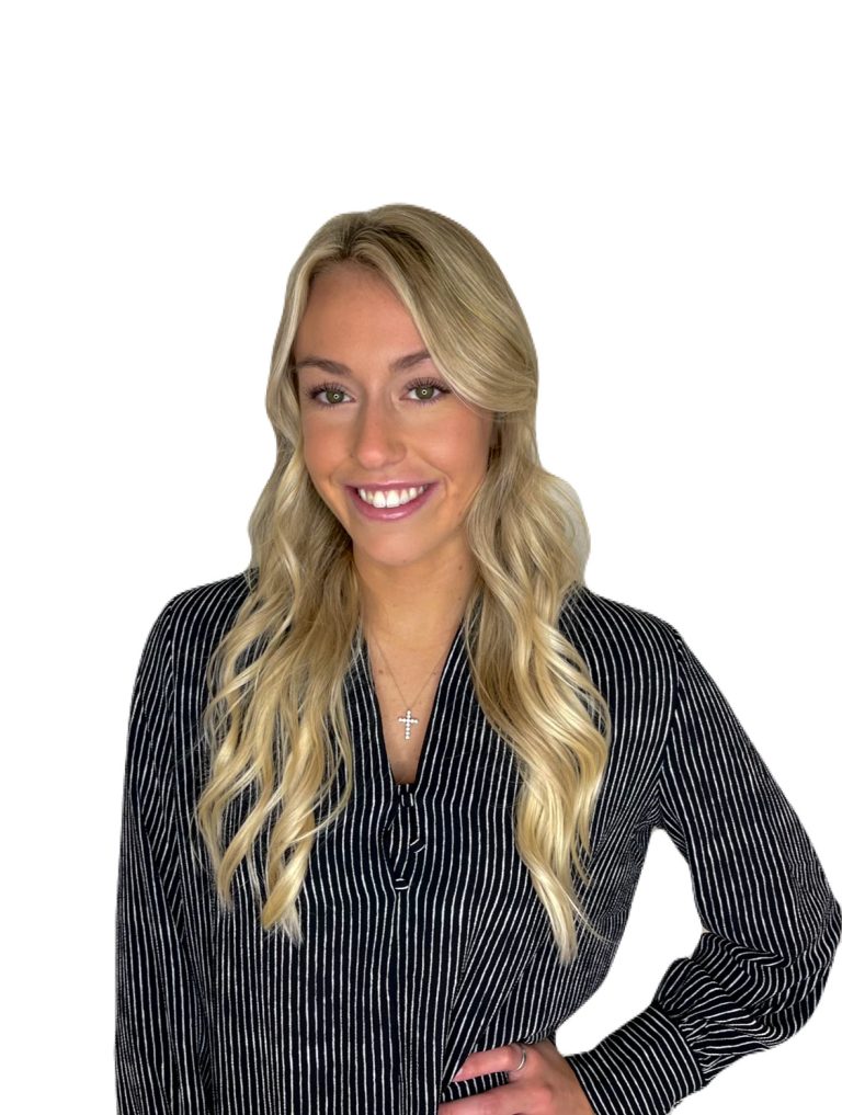 Woman in striped shirt smiling confidently.